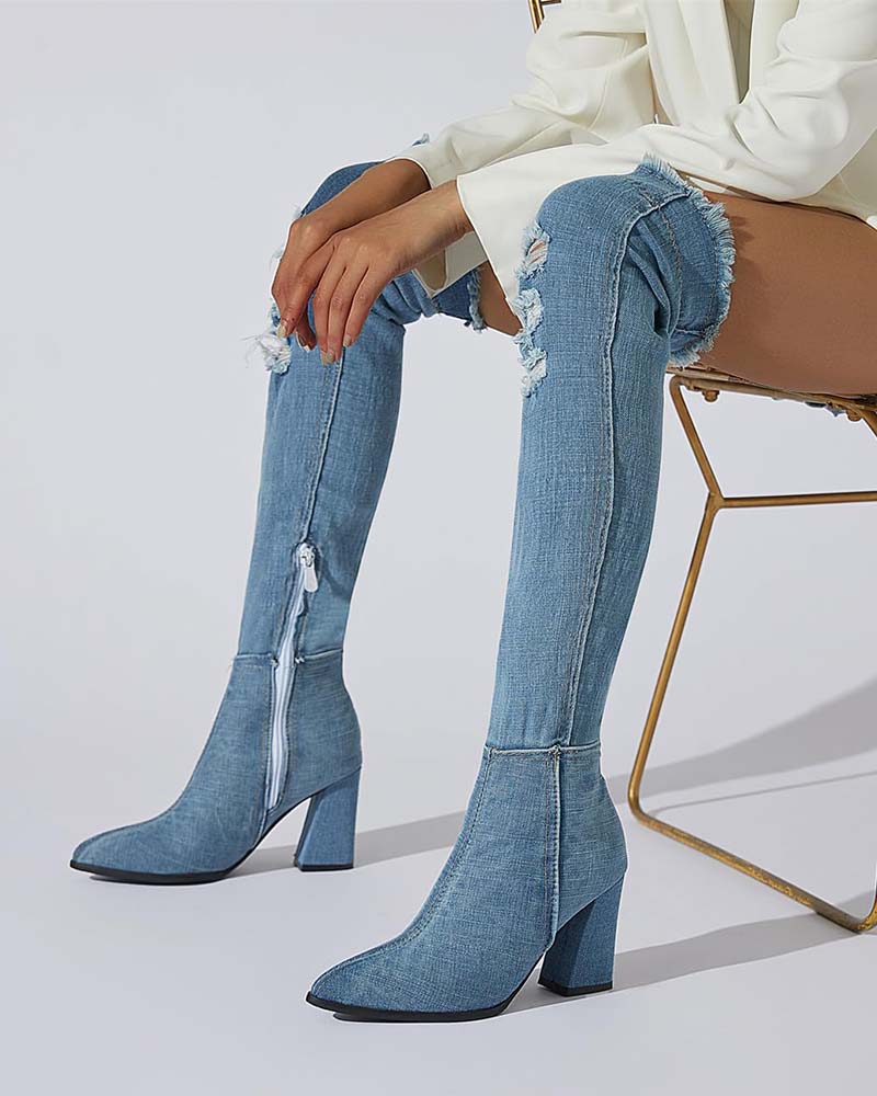 Over-the-knee stiletto boots in light blue distressed denim, pointed toe, tall heel, side zip.