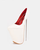 White patent platform stiletto pump with pointed toe and tall thin stiletto heel