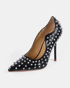 Black patent pointed-toe stiletto pump with silver spike studs, high heel
