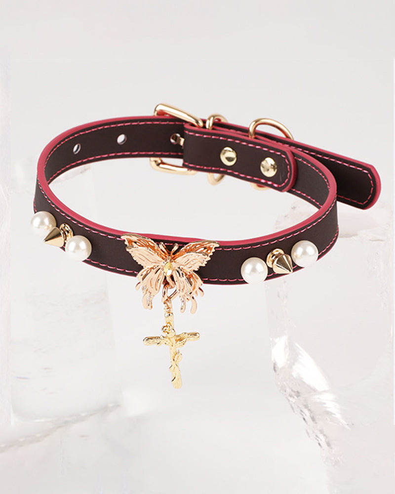 Spiked leather choker collar with butterfly pendant, pearl studs, and D-ring clasp