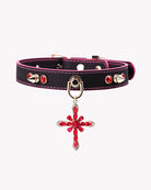 Black PU pet collar with magenta edge stitch, stud accents, and red jeweled cross charm