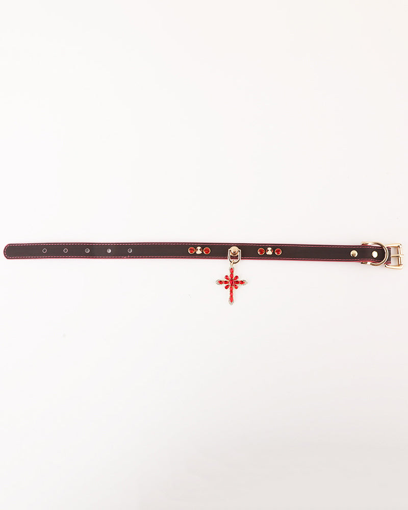 Black PU pet collar with magenta trim and metal buckle, with red cross charm hanging