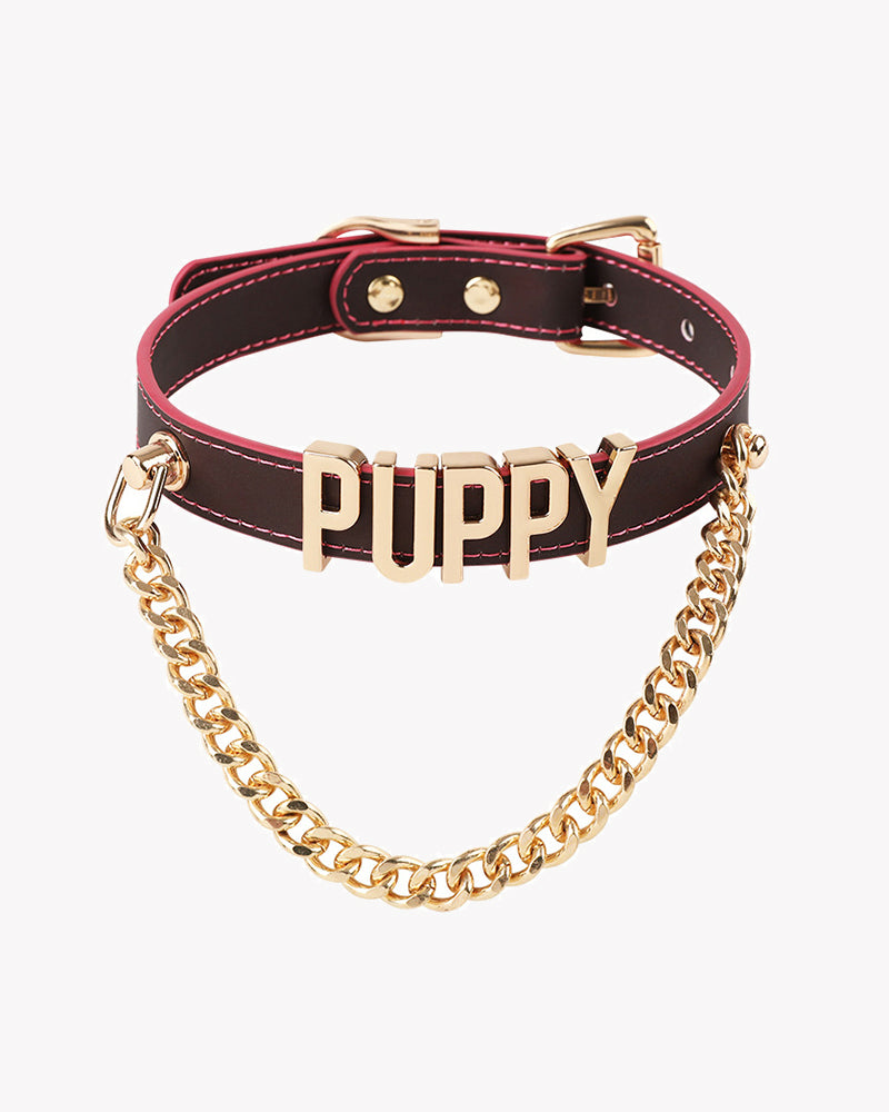 Leather dog collar with gold chain, pink stitching, and metallic PUPPY letter tag