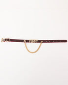 Leather dog collar with gold chain and metallic PUPPY letters; side buckle detail