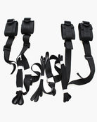Black restraint band with adjustable fabric straps and buckles, set of two cuffs