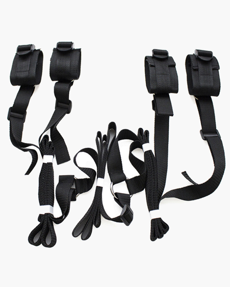 Black restraint band with adjustable fabric straps and buckles, set of two cuffs