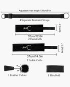 Black adjustable restraint strap set with metal rings, handcuff and ankle cuff pieces