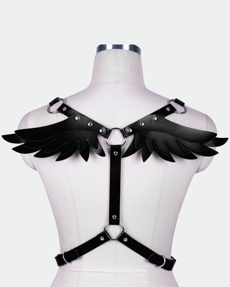 Black leather wing harness on mannequin with studded wing shoulders and chest strap