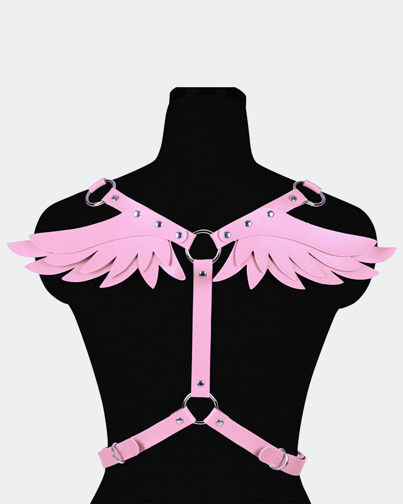 Pink leather wing harness with studded wing panels and adjustable straps, front view
