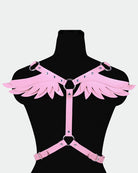 Pink leather wing harness with studded wing panels and adjustable straps, front view