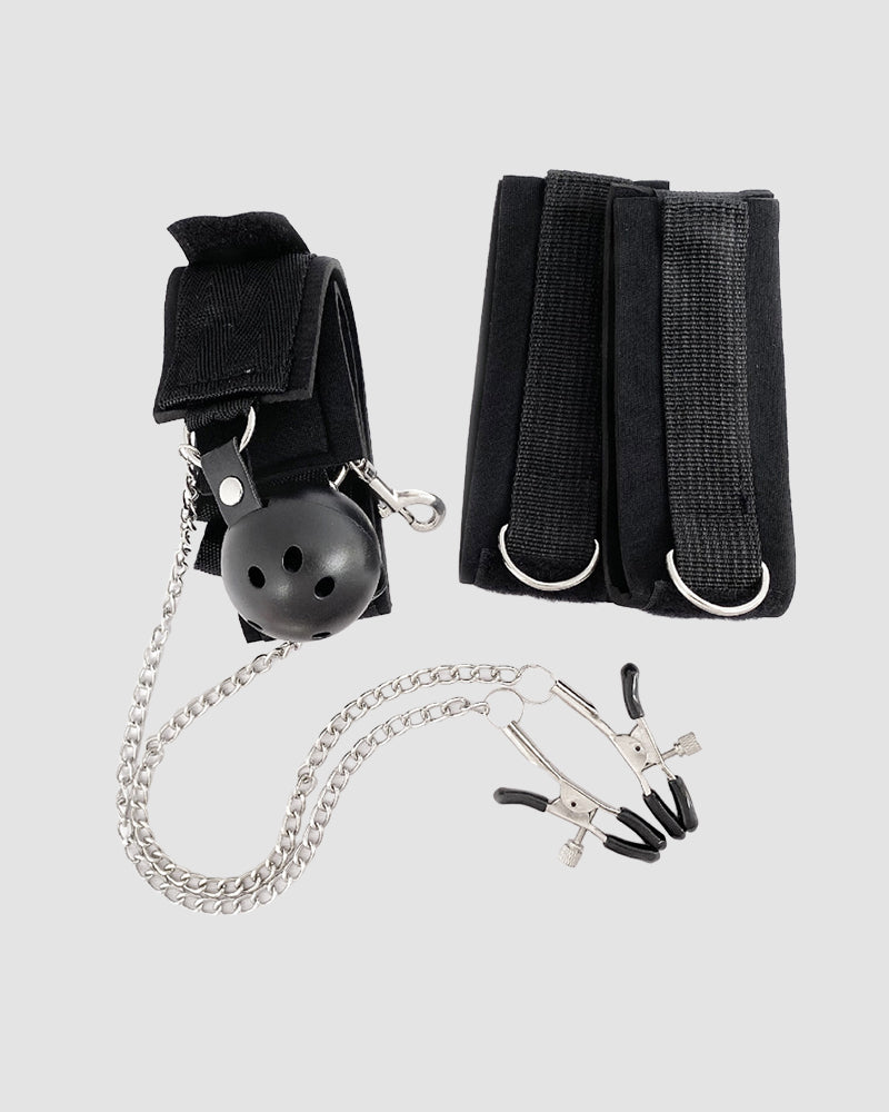 Black fabric cuffs, metal ball gag, and silver chain with clip fasteners