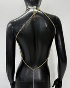 Gold chain body harness with Y-shaped straps and tassel drape on back