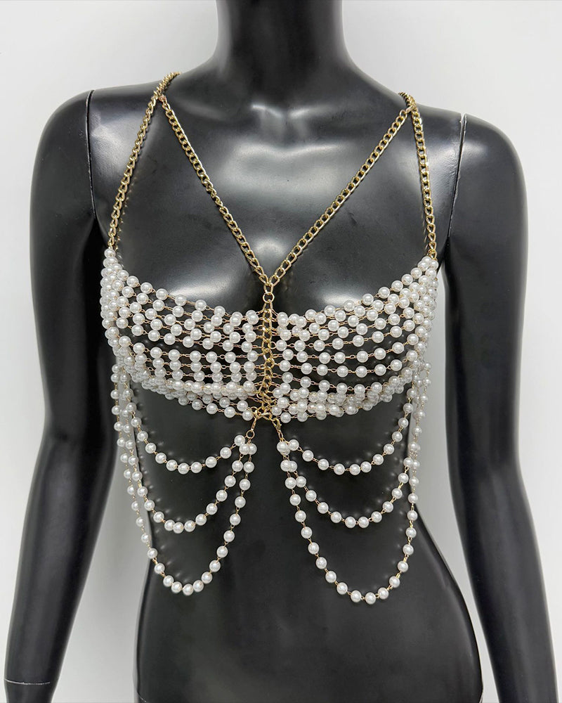 Gold pearl chest chain body accessory with layered bead fringe on a mannequin torso