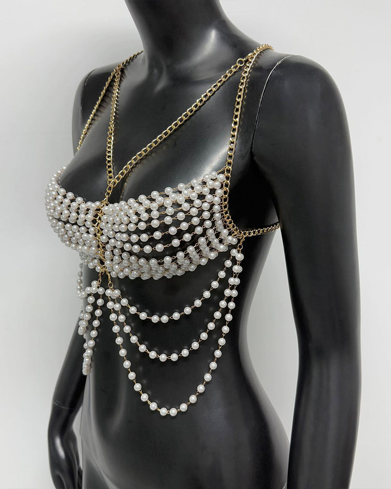 Gold pearl chest chain body accessory with draped bead fringe and side shoulder chain on mannequin
