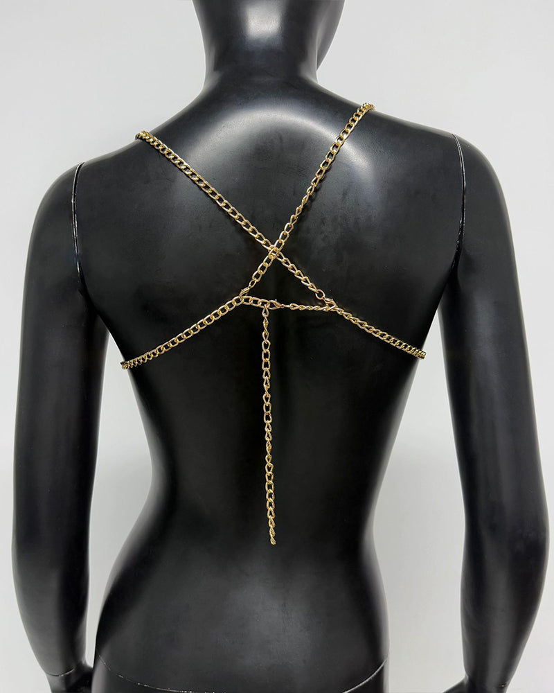 Gold pearl chest chain body accessory with crisscross straps and long drop chain on a back view
