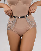Black leather hip harness with oval buckle and silver chain rows across front