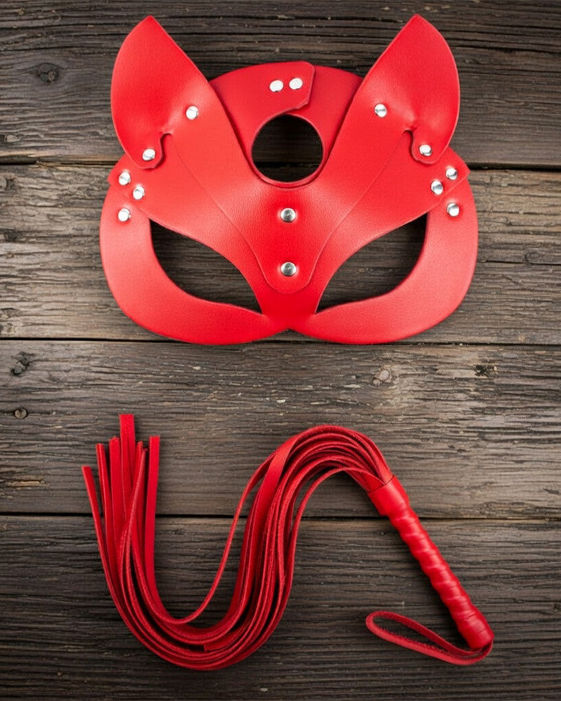 Red leather cat mask with ear cutouts, eye opening, and silver stud details with leash