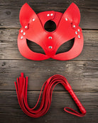 Red leather cat mask with ear cutouts, eye opening, and silver stud details with leash