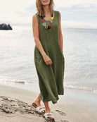 Green sleeveless pocket dress with scoop neck and sleeveless A-line silhouette