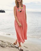 Pink sleeveless pocket dress with scoop neck and relaxed sleeveless fit