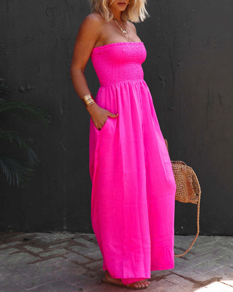 Rose red pleated tube top jumpsuit with strapless bodice and gathered waist.