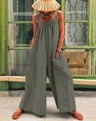 Dark gray sleeveless backless bodysuit with wide-leg trousers, gathered neckline