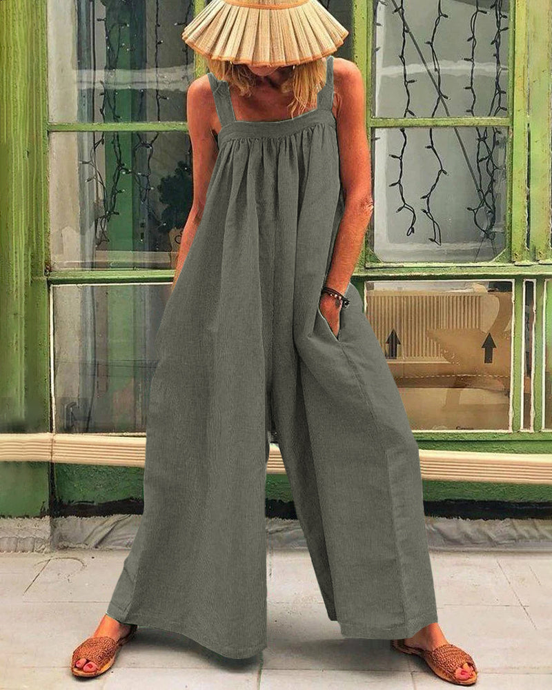 Dark gray sleeveless backless bodysuit with wide-leg trousers, gathered neckline
