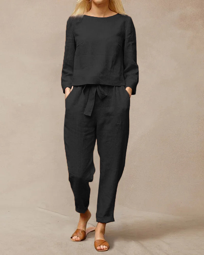 Black two-piece pants set with long-sleeve top and drawstring waist ankle pants