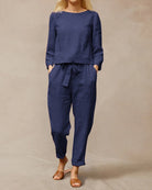 Blue two-piece pants set with long-sleeve top and drawstring waist ankle pants