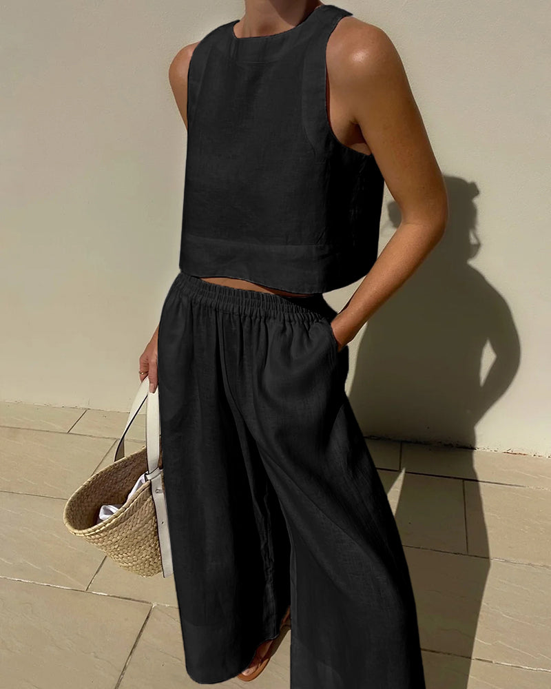 Black sleeveless crop top and wide-leg pants set with elastic waist, relaxed fit.