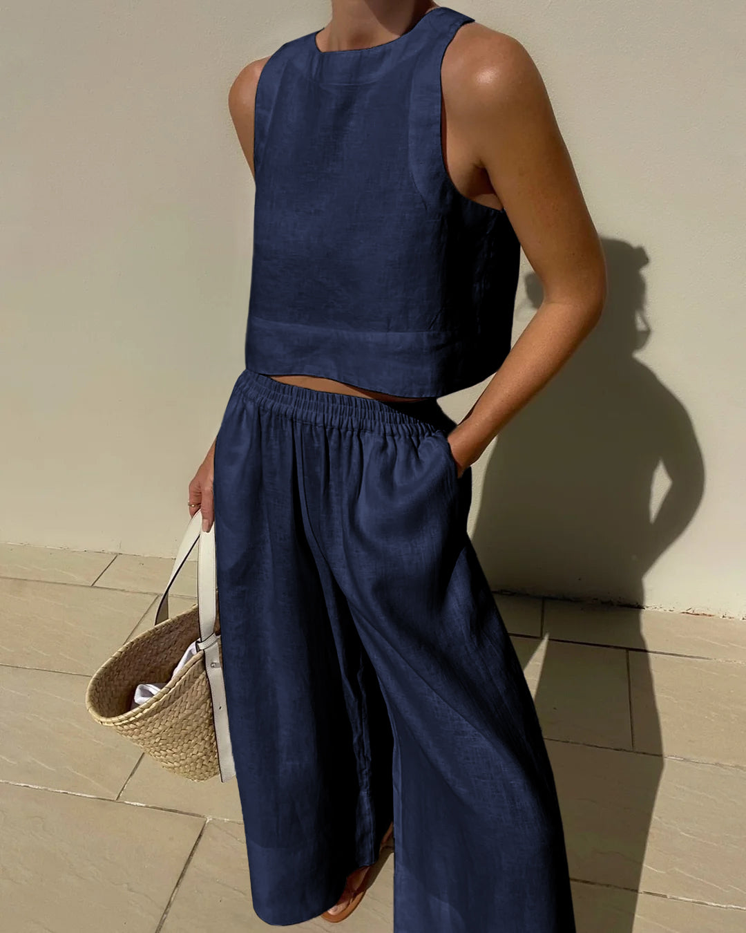 Navy sleeveless crop top and wide-leg pants set with elastic waist, relaxed wide legs.