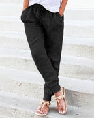 Black drawstring jogger pants with front pockets