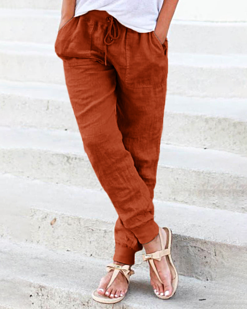 Rust orange drawstring jogger pants with front pockets