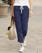 Blue drawstring elastic-waist pants, tapered ankle-length with white rope tie