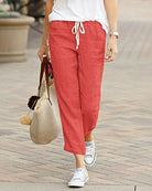 Red drawstring elastic-waist pants, tapered ankle-length with white rope tie