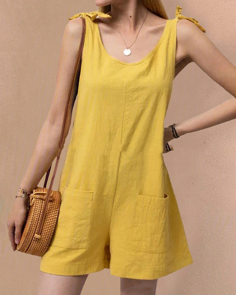 Sleeveless yellow pocket shorts jumpsuit with bow shoulder ties and front pockets
