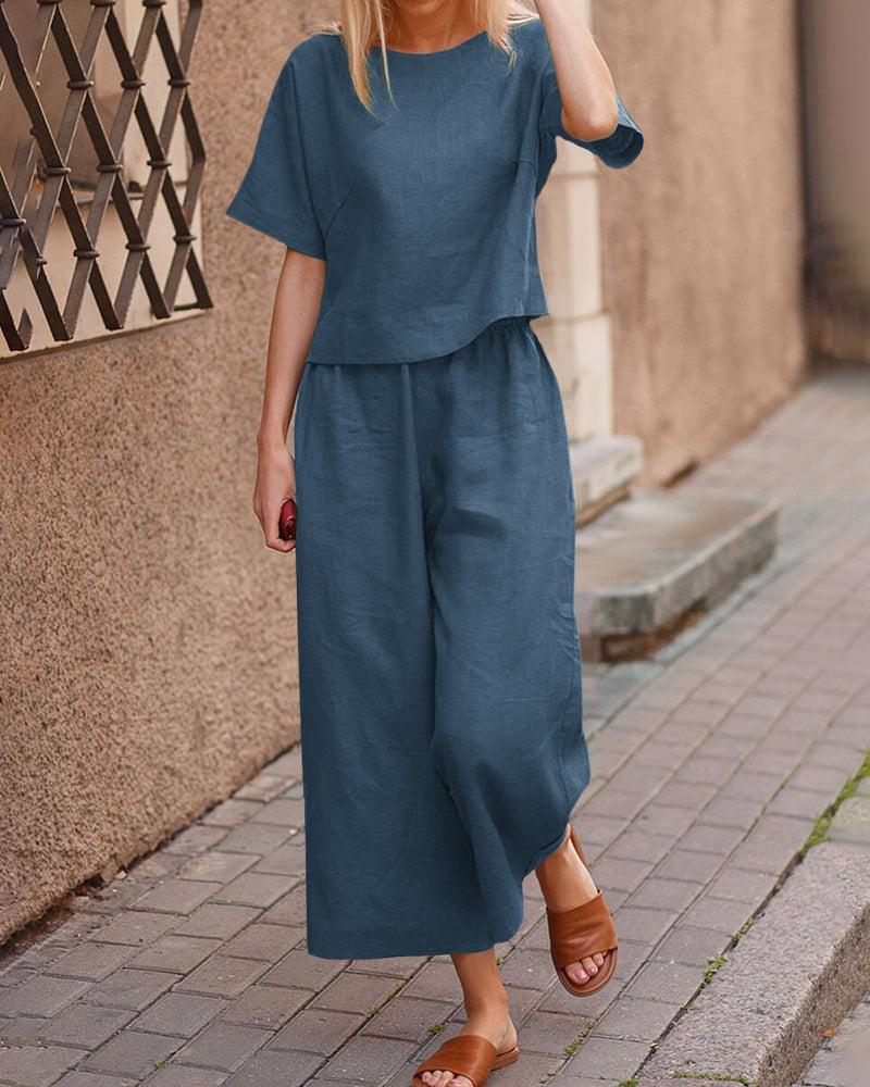 Navy blue two-piece set with loose T-shirt and wide-leg cropped pants