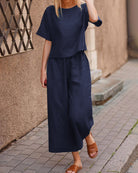 Loose fit two piece set: navy short-sleeve top and wide-leg cropped pants