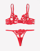 Red lace lingerie set with kiss-print embroidery bra, garter straps, and thong