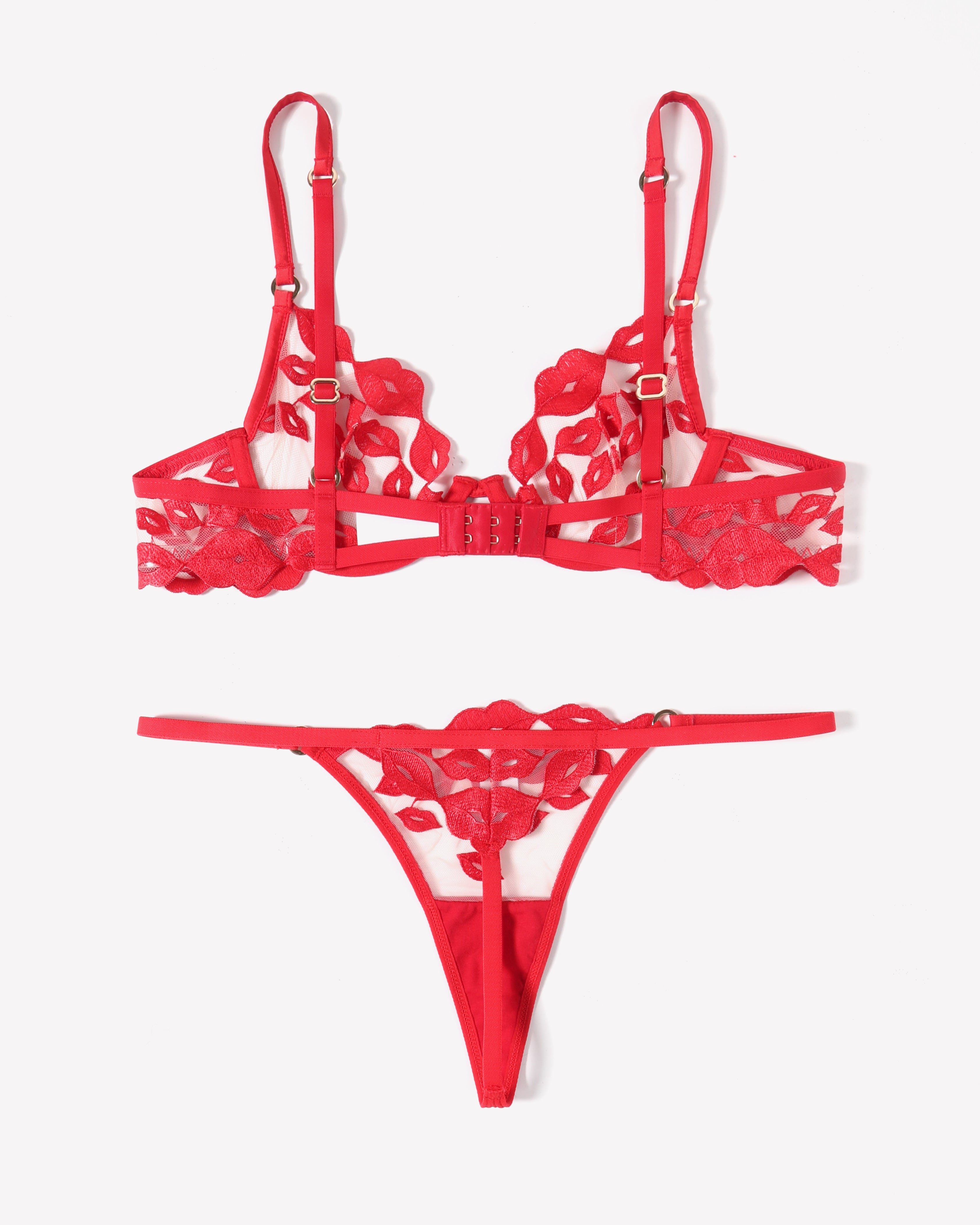 Red lace lingerie set with kiss-print embroidery bra, garter straps, and thong