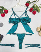 Teal satin strappy bow lingerie set with bra, thong, and garter straps