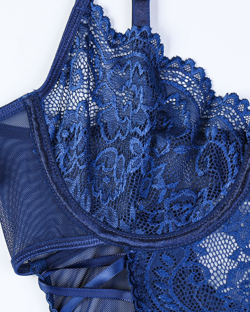 Dark blue lace bra cups with scalloped edges and sheer floral overlay