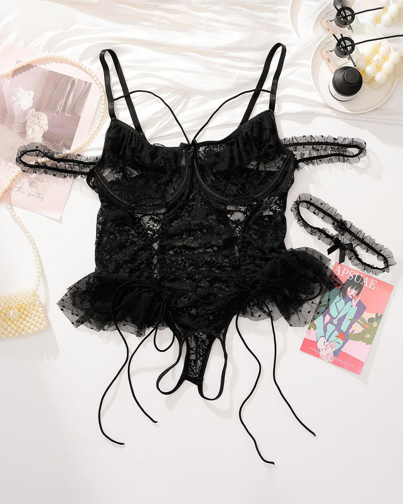 Black sheer lace bodysuit flat lay with adjustable straps and tulle ruffle hem