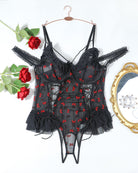 Black sheer lace bodysuit on hanger with red bow pattern and tulle ruffle skirt