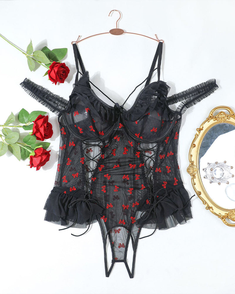 Black sheer lace bodysuit on hanger with red bow pattern and tulle ruffle skirt