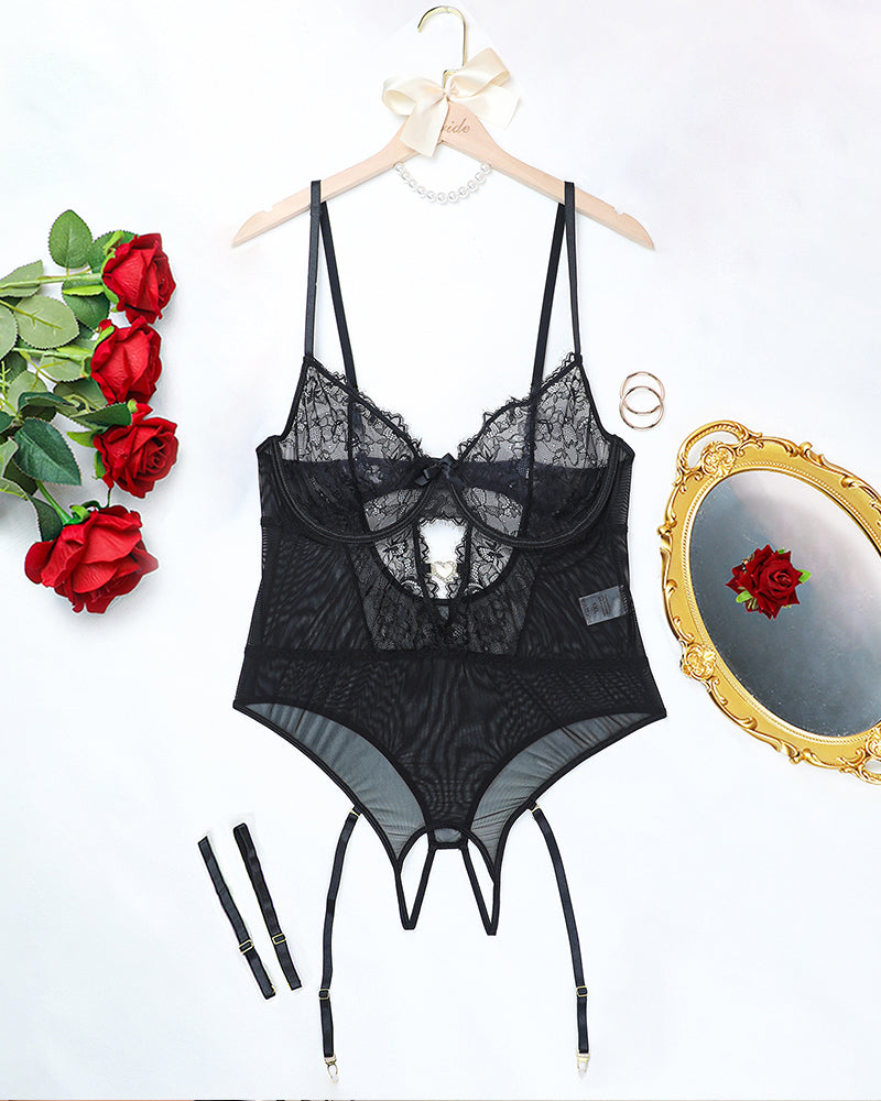 Black floral lace bodysuit set on hanger with underwire cups, garters, and thong
