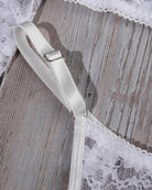 White elastic strap with metal adjuster on lace lingerie set