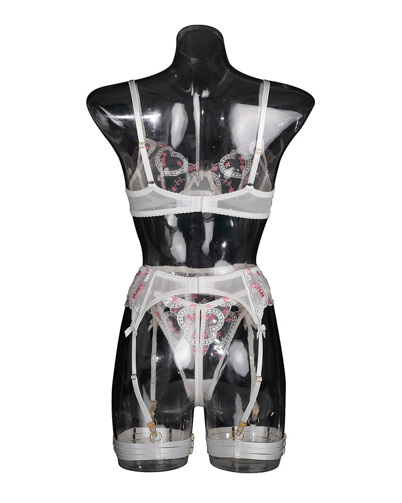 Front view of white lace lingerie set with heart embroidery, underwire bra, garter straps.
