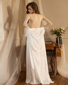 White satin night robe with open-back crisscross straps and lace-trim hem