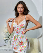 White floral satin slip dress with lace trim and spaghetti straps